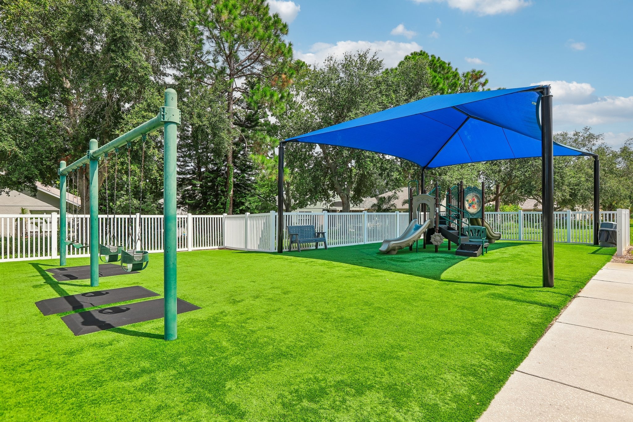 Key Vista community playground with shaded play area in Holiday FL