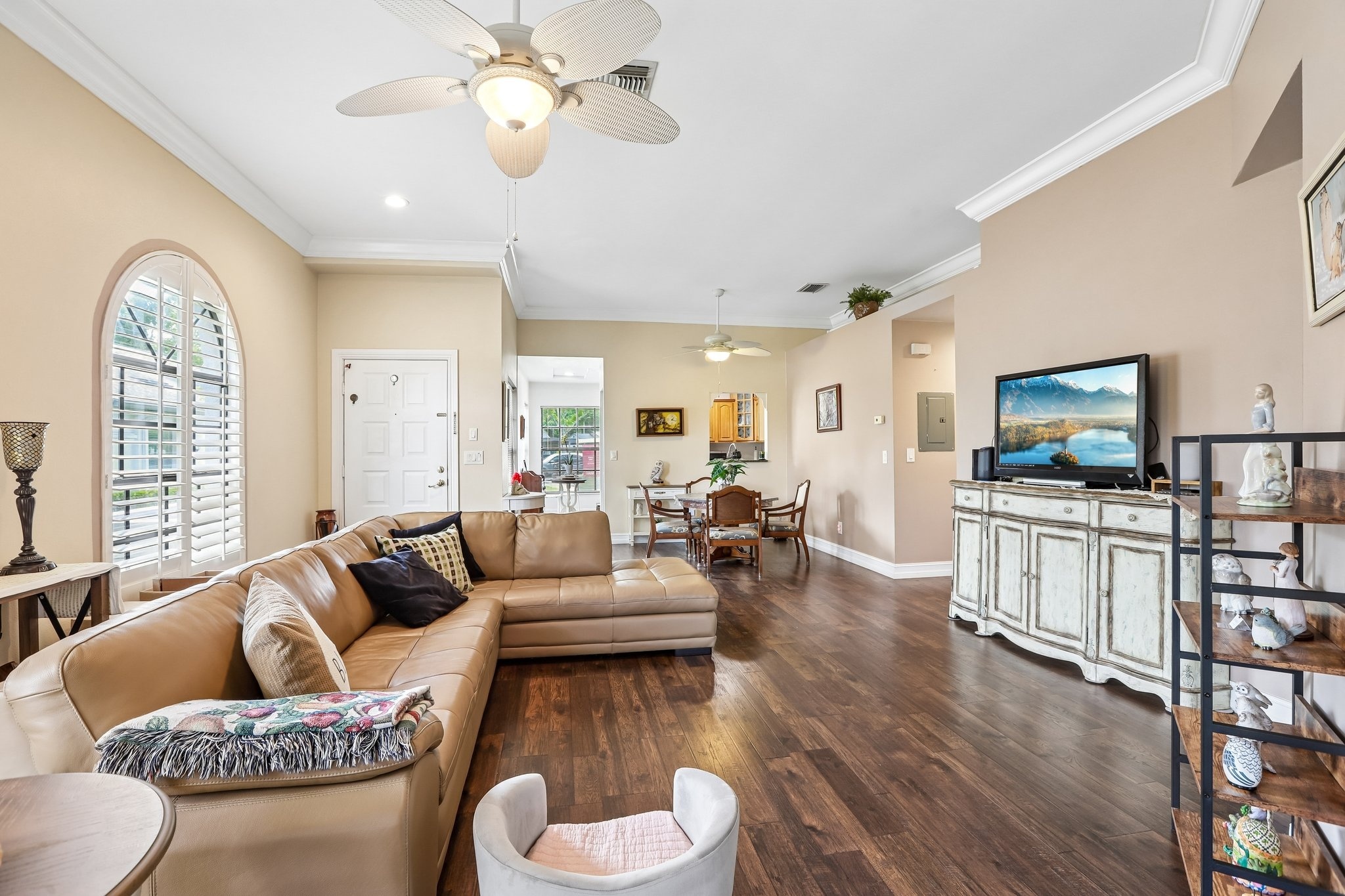 Open living and dining combo with laminate flooring in this Palm Harbor end-unit villa for sale