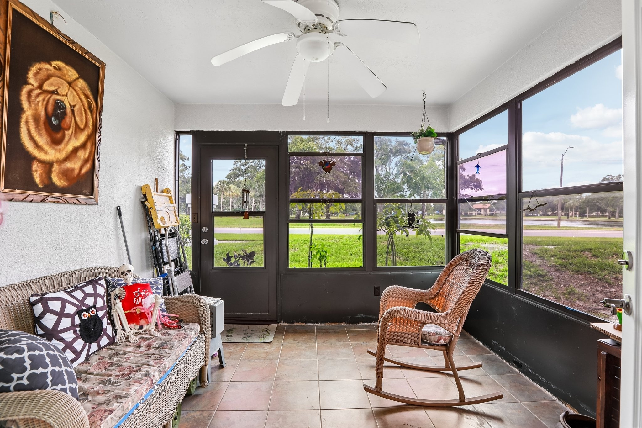 Enclosed lanai overlooking Crystal Lake and the park at 3878 Tanager Pl, Palm Harbor FL