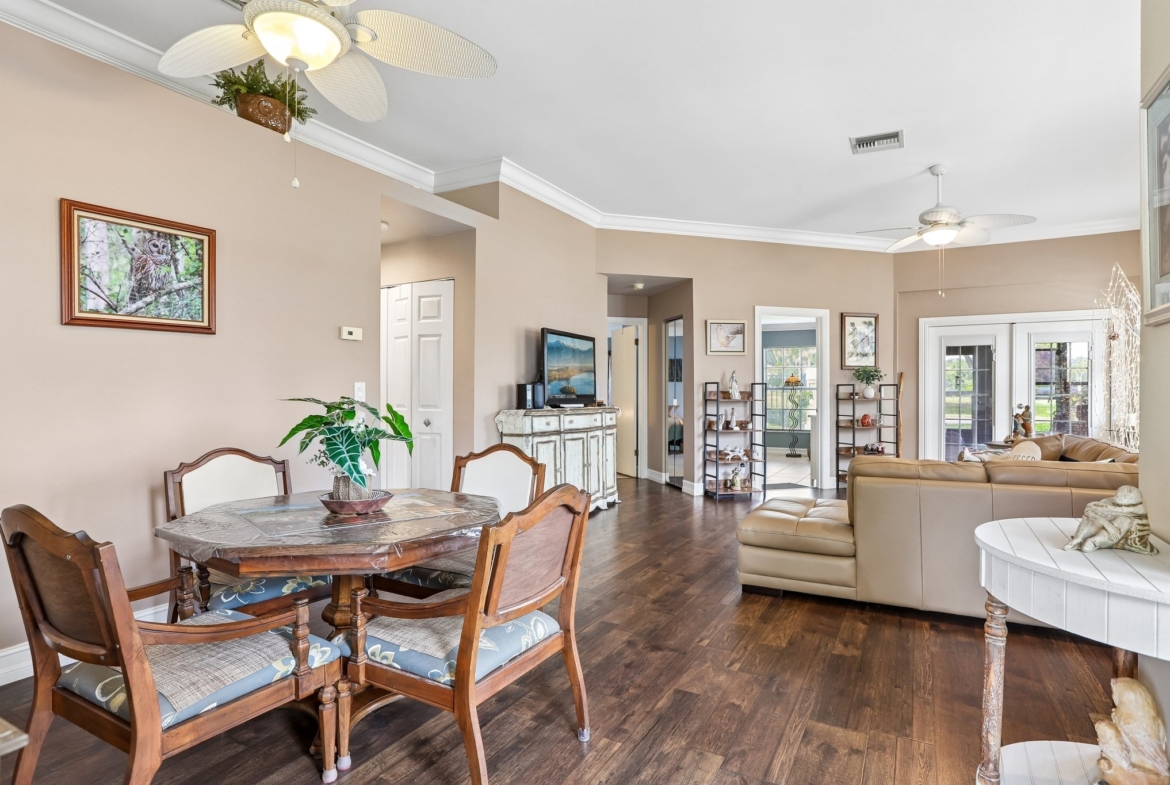 Dining area open to the living room in this 3 bedroom Palm Harbor villa for sale