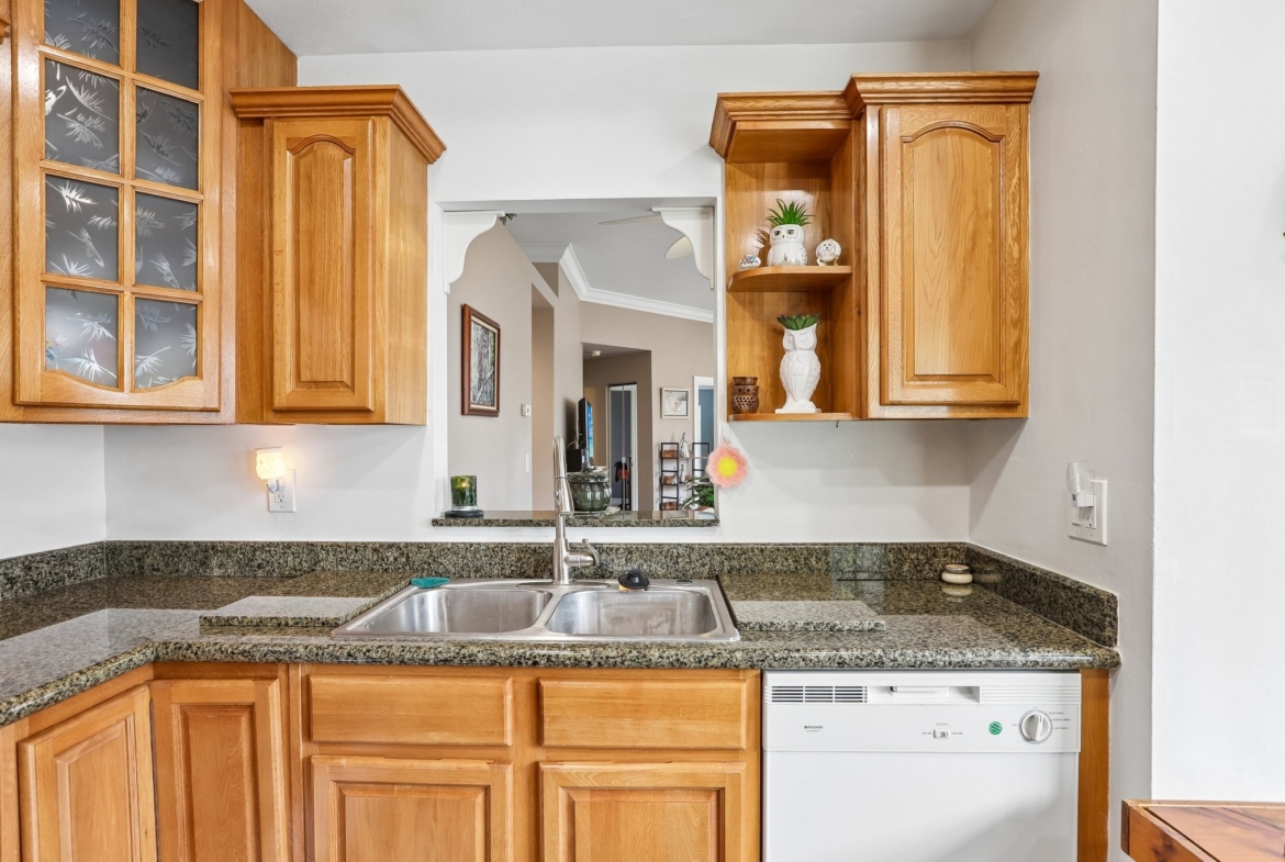 Kitchen with granite counters and pass-through to the living area, Palm Harbor FL