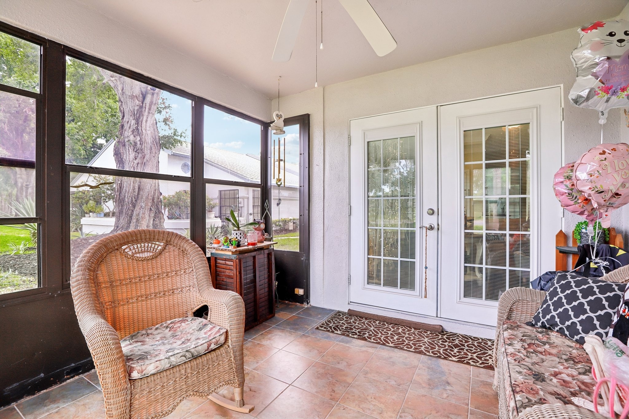 Enclosed lanai with French doors and park views at 3878 Tanager Pl, Palm Harbor FL