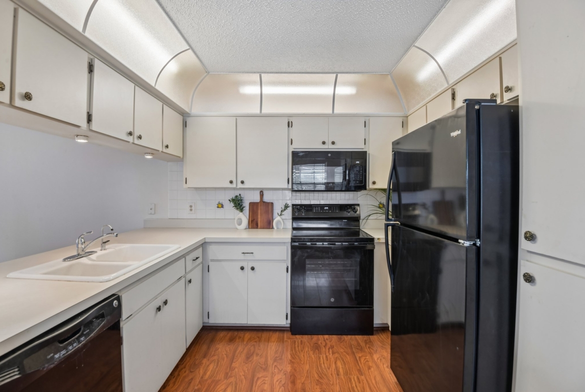 Kitchen with new 2025 electric range, 2022 refrigerator and 2020 microwave, Hudson FL 34667