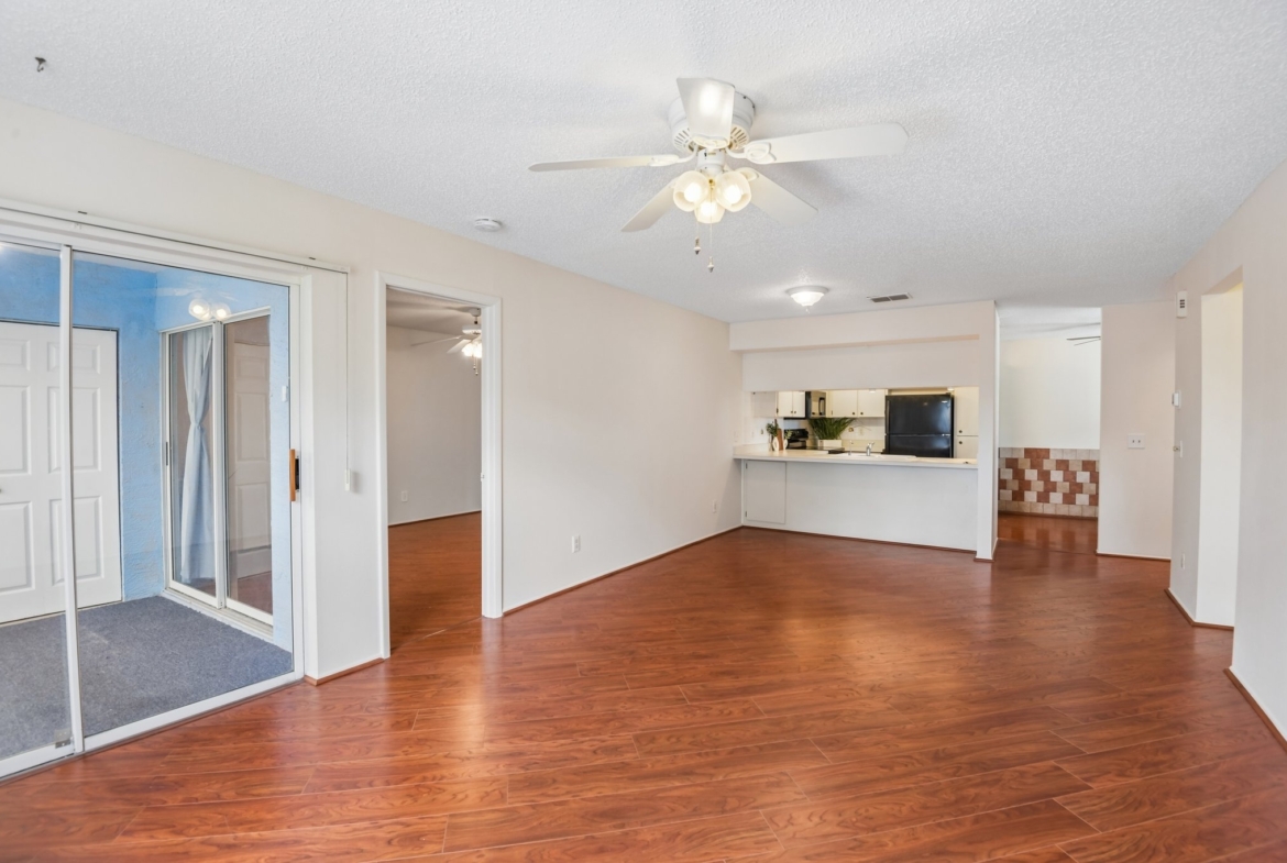 Open living room dining room combo looking toward the kitchen at 7713 Hillside Ct #204, Hudson FL