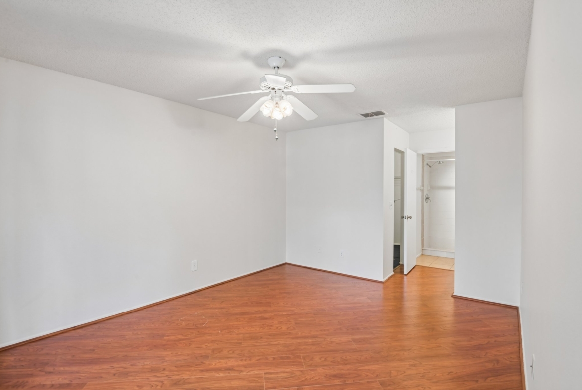 Second bedroom with ceiling fan and laminate flooring, Hudson FL 55+ condo for sale