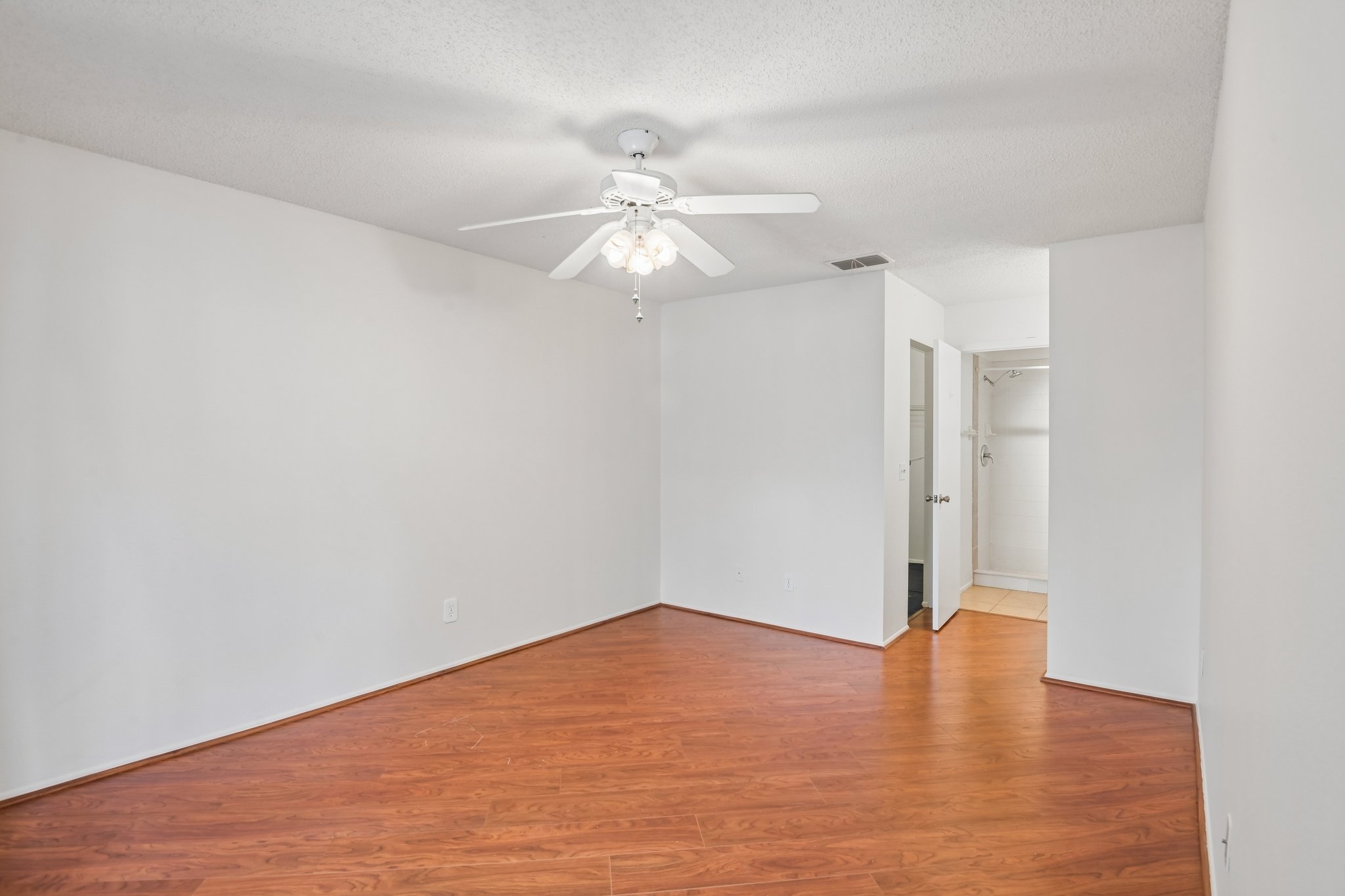 Second bedroom with ceiling fan and laminate flooring, Hudson FL 55+ condo for sale