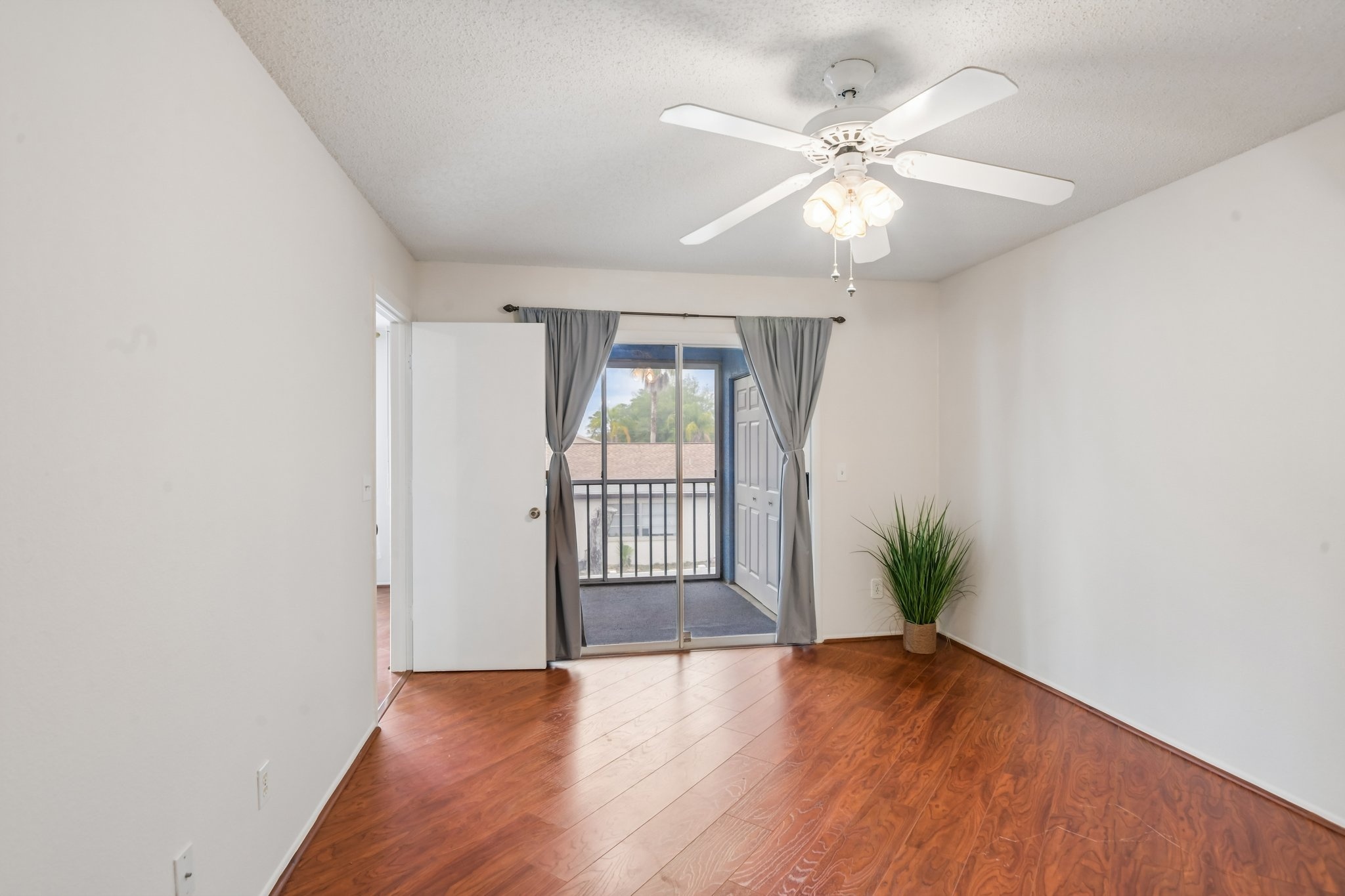 Bedroom with sliding doors to the private screened balcony, Hudson FL 34667