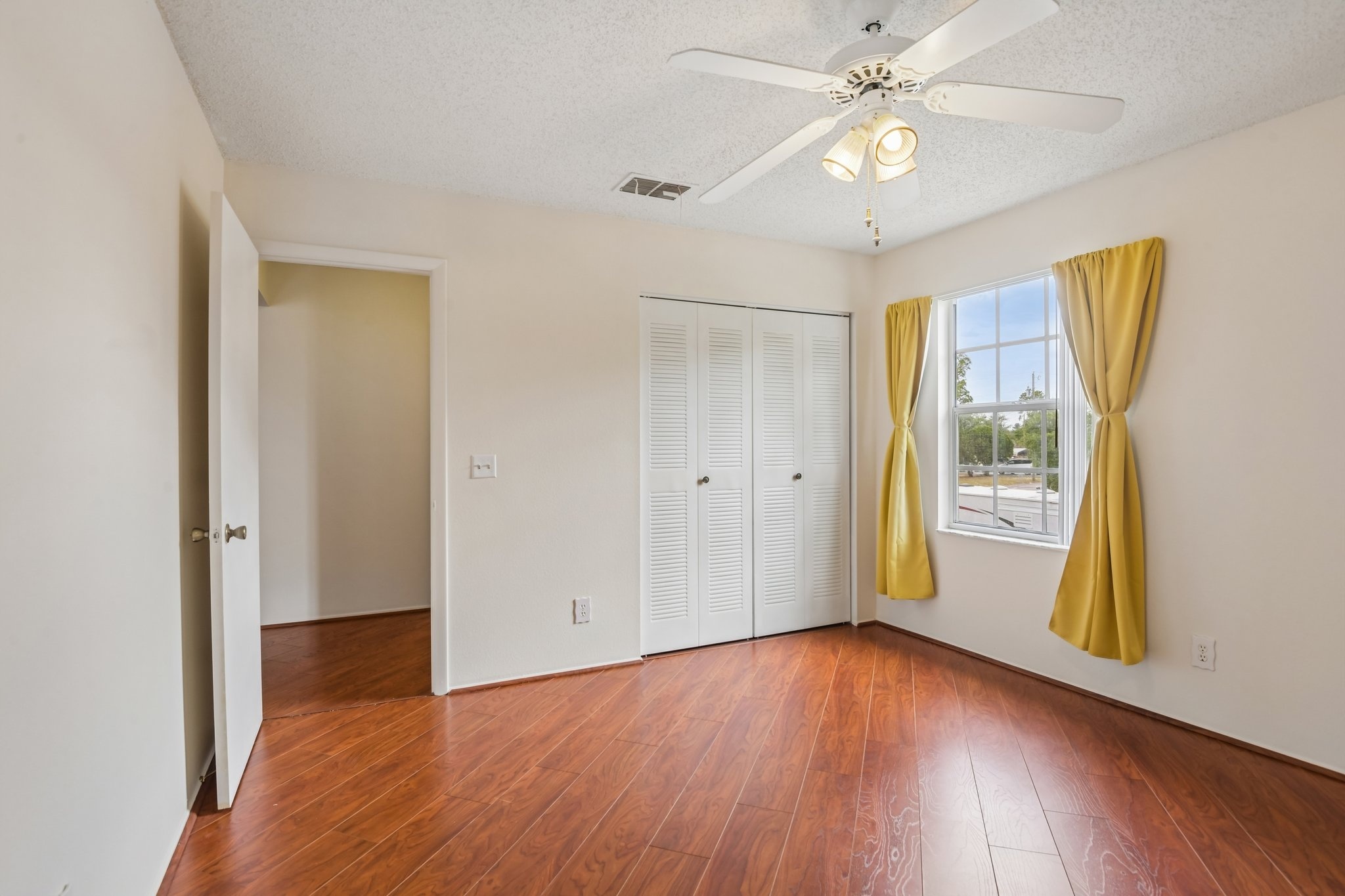 Bedroom with closet and natural light at 7713 Hillside Ct #204, Hudson, FL 34667