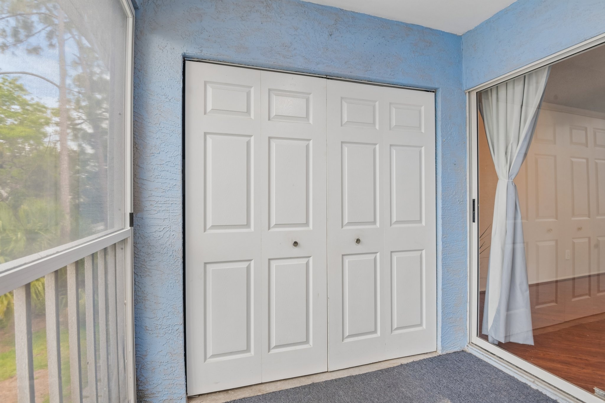 Private screen-enclosed balcony with extra storage closet, Hudson FL 34667