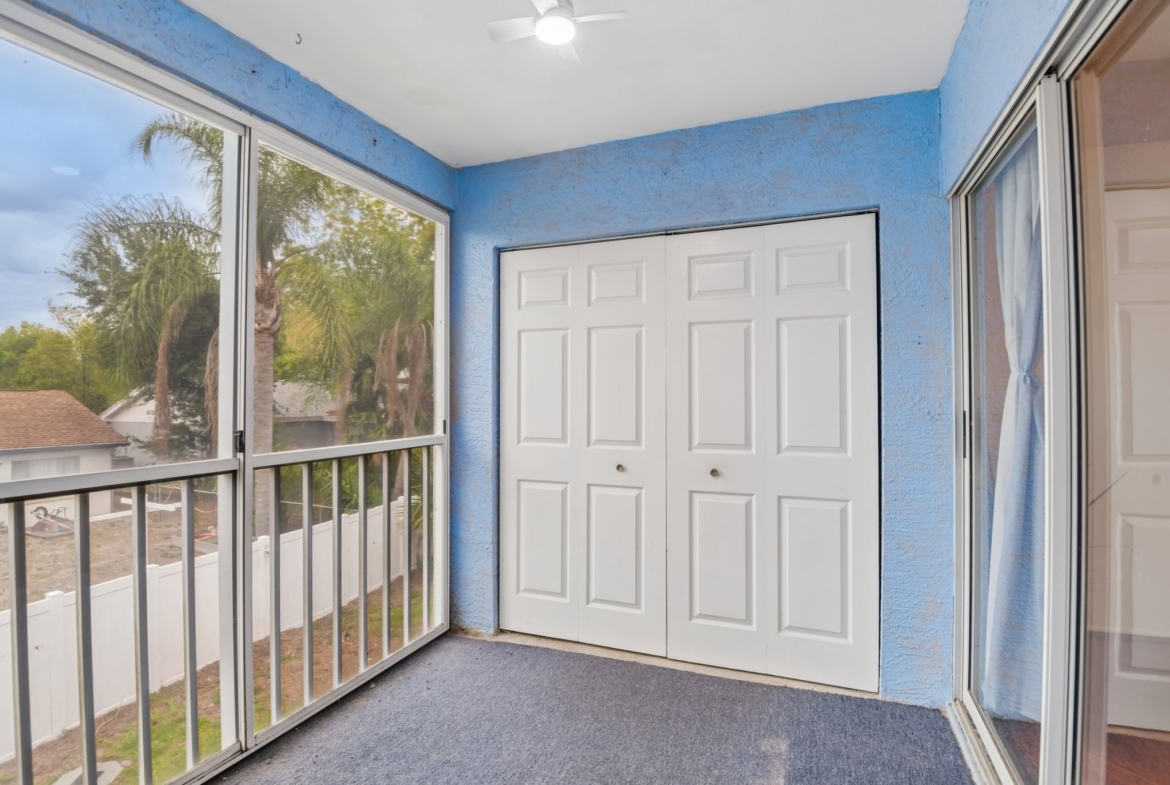 Private screen-enclosed balcony overlooking the grounds at The Hillside, Hudson FL 34667