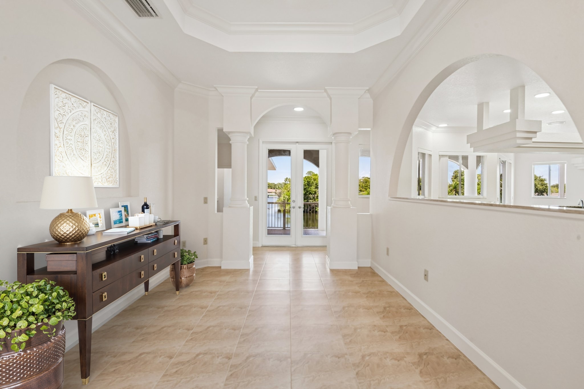 Foyer and entry hall with tile flooring at 8335 Cheyenne Dr in Lake Seminole Park Trails, Seminole FL