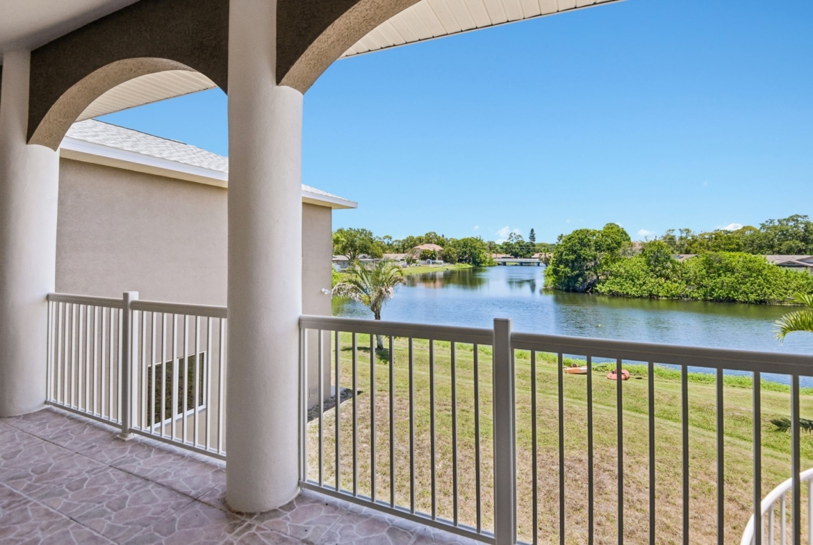 Canal and water view from the covered balcony of this waterfront home in Seminole FL