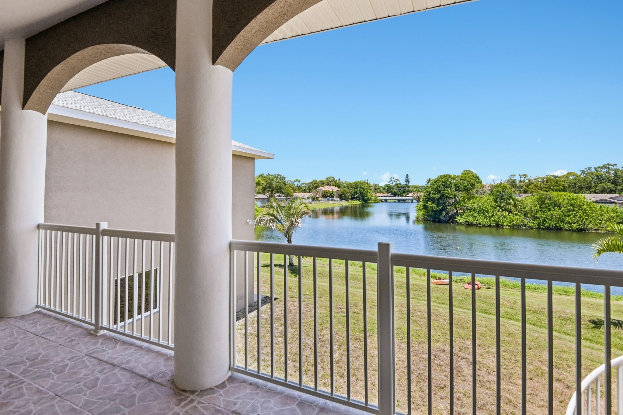 Canal and water view from the covered balcony of this waterfront home in Seminole FL