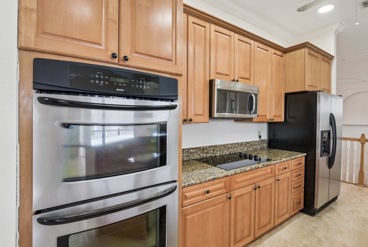 Gourmet kitchen with double built-in oven and cooktop at 8335 Cheyenne Dr, Seminole FL