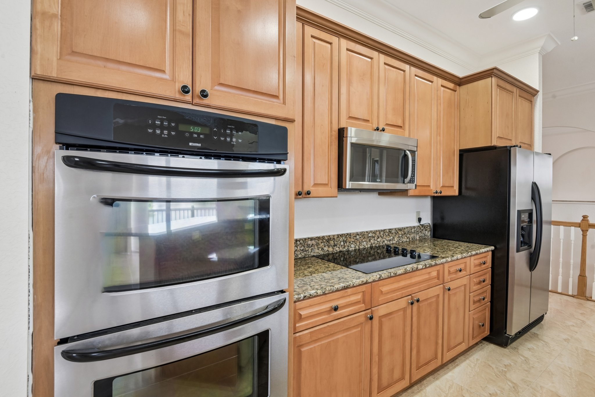 Gourmet kitchen with double built-in oven and cooktop at 8335 Cheyenne Dr, Seminole FL