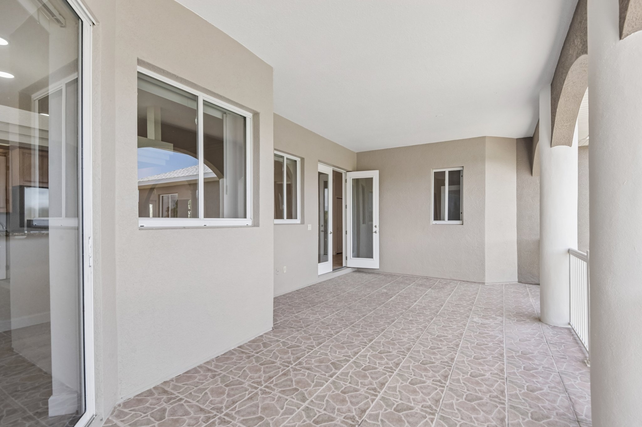 Open great room with windows overlooking the water at 8335 Cheyenne Dr, Seminole FL
