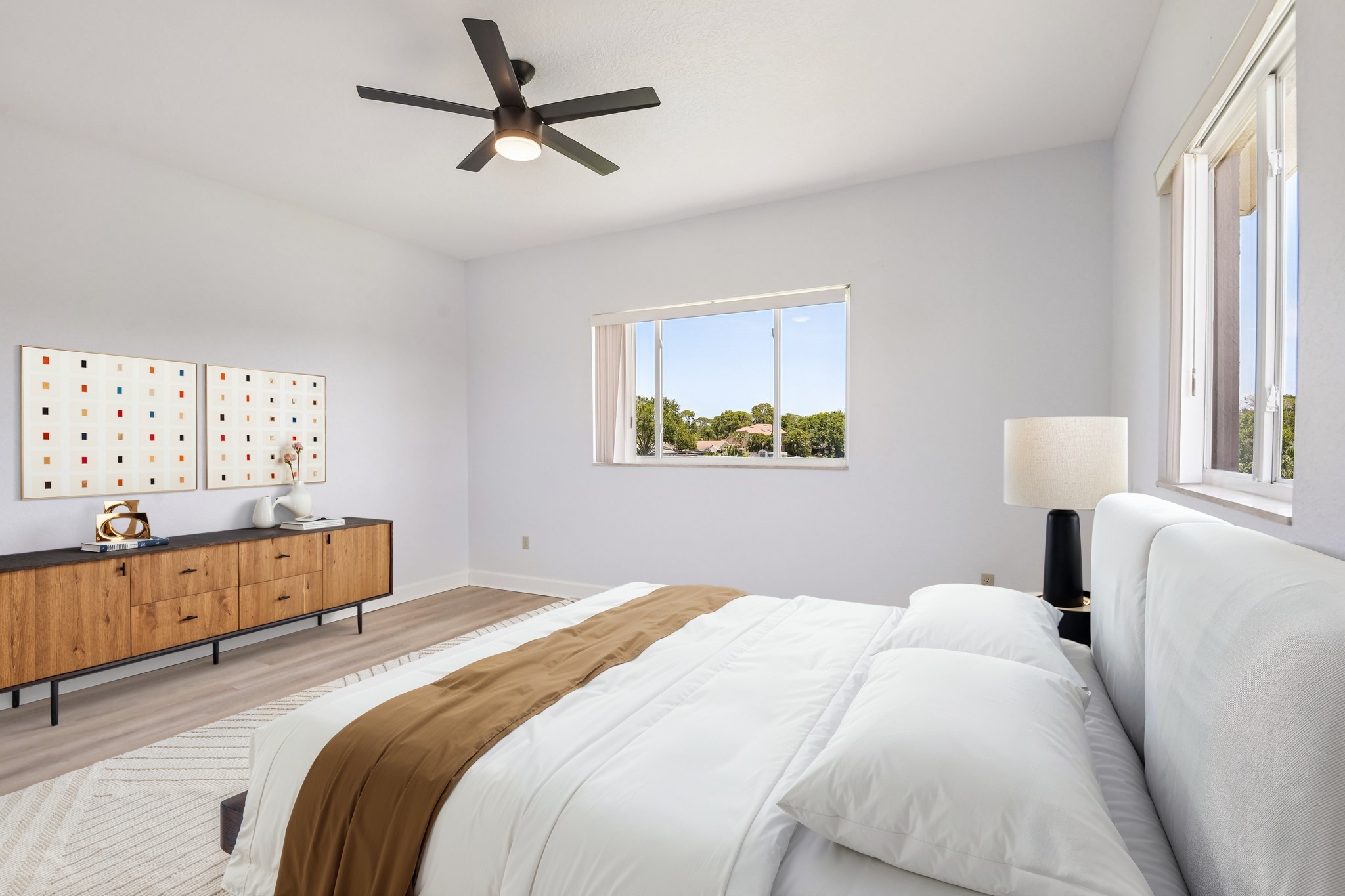Massive private primary suite with ceiling fan and water views at 8335 Cheyenne Dr, Seminole FL