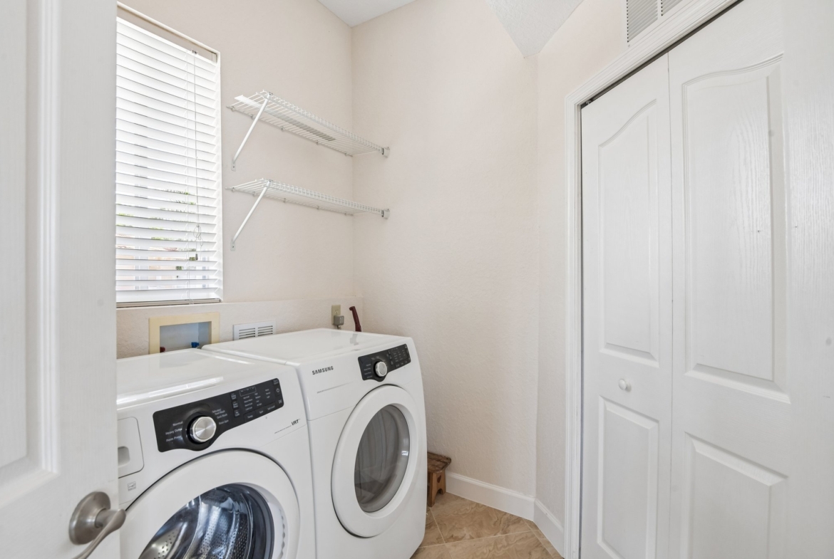 Inside laundry room with washer and dryer at 8335 Cheyenne Dr, Seminole FL