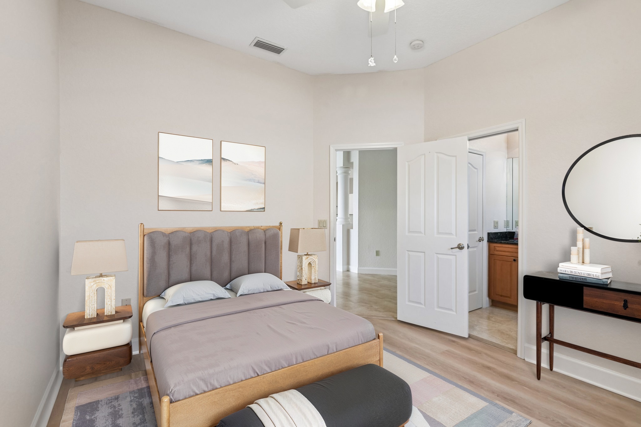 Virtually staged primary suite with sitting area in this Seminole FL waterfront home for sale