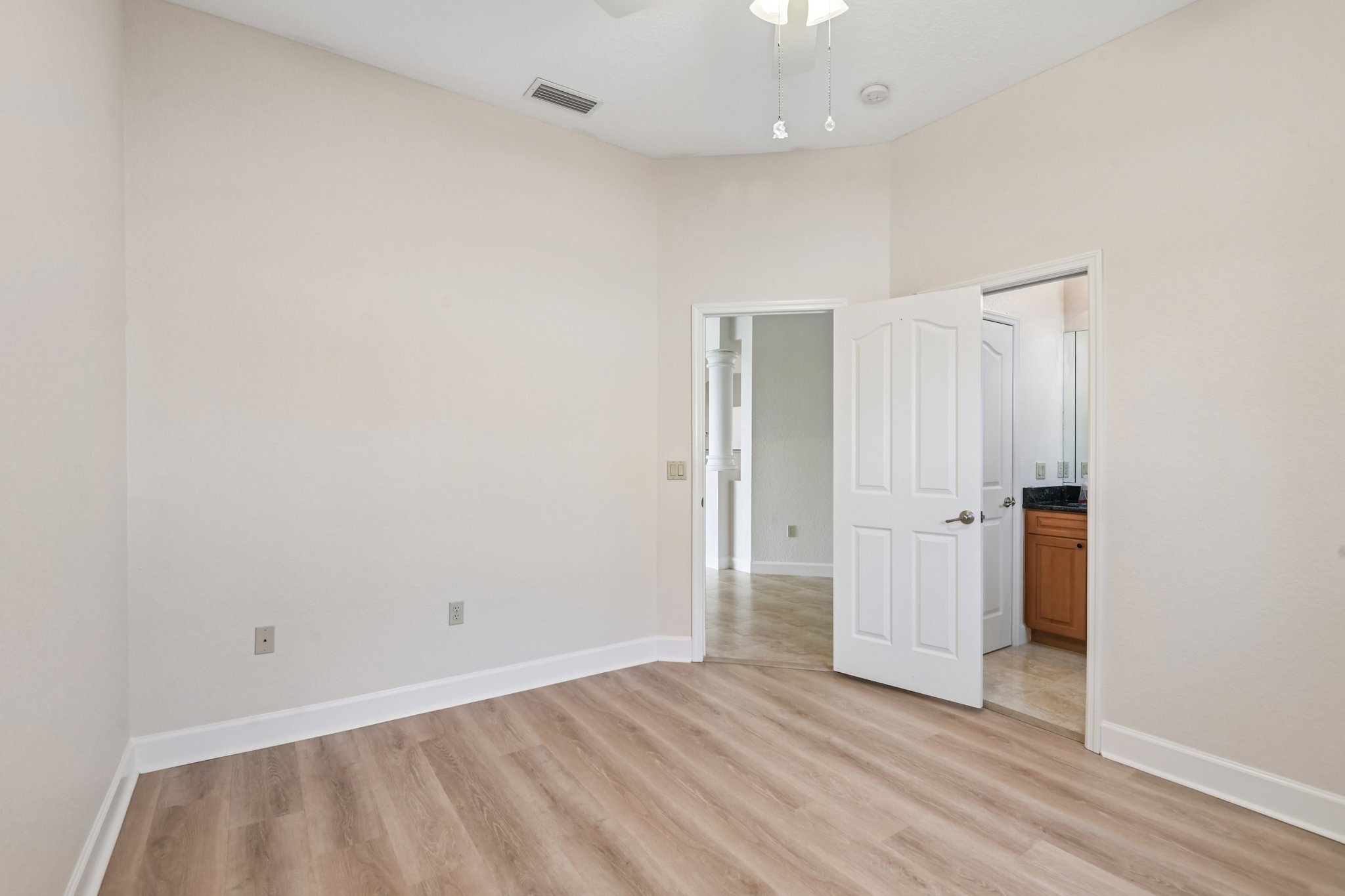 Spacious bedroom with private bath access at 8335 Cheyenne Dr, Seminole FL 33777