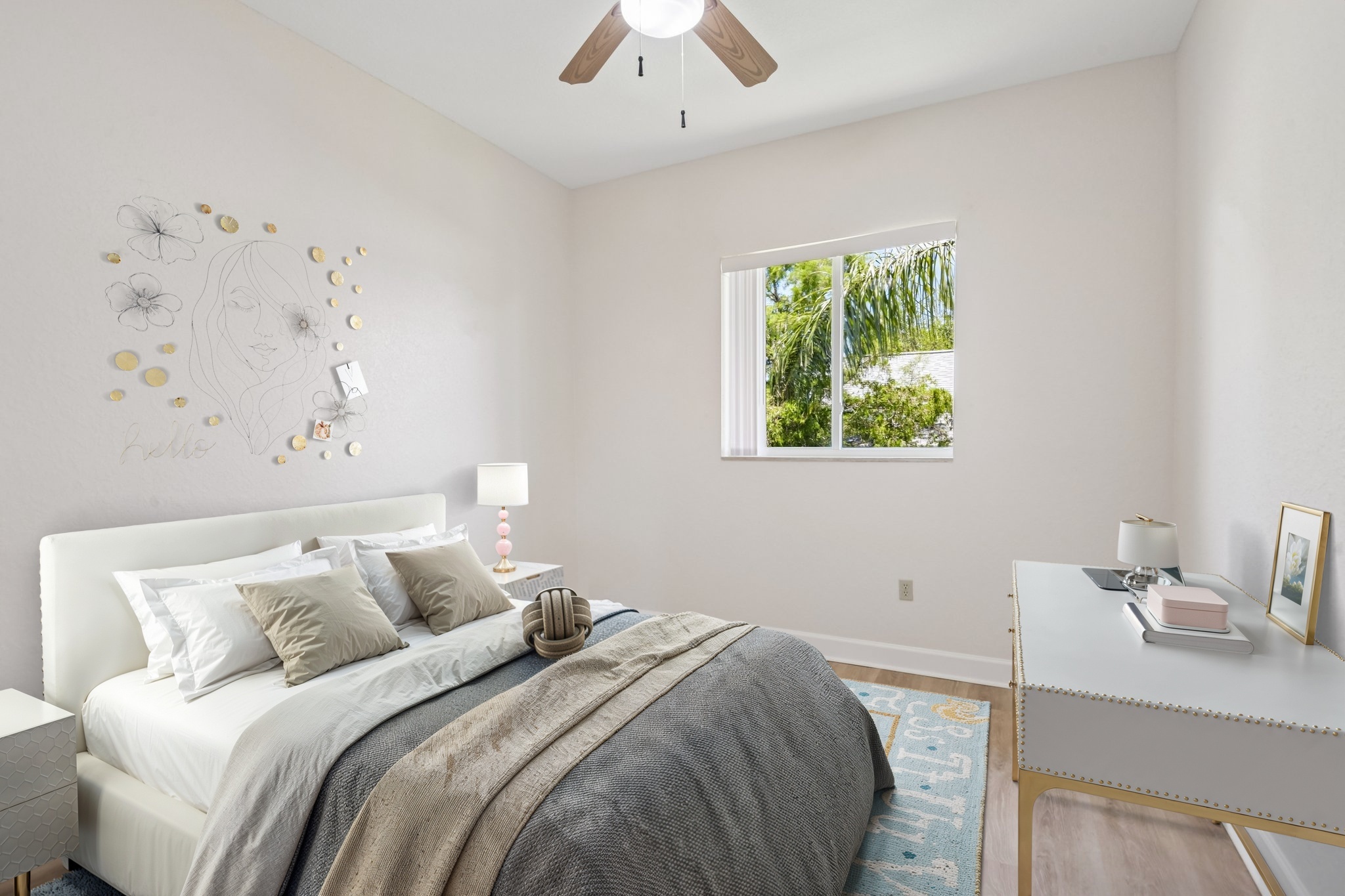 Virtually staged guest bedroom with ceiling fan at 8335 Cheyenne Dr, Seminole FL